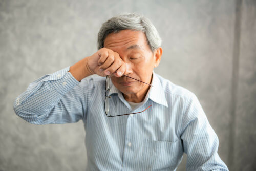 Elderly man suffering from macular degeneration.