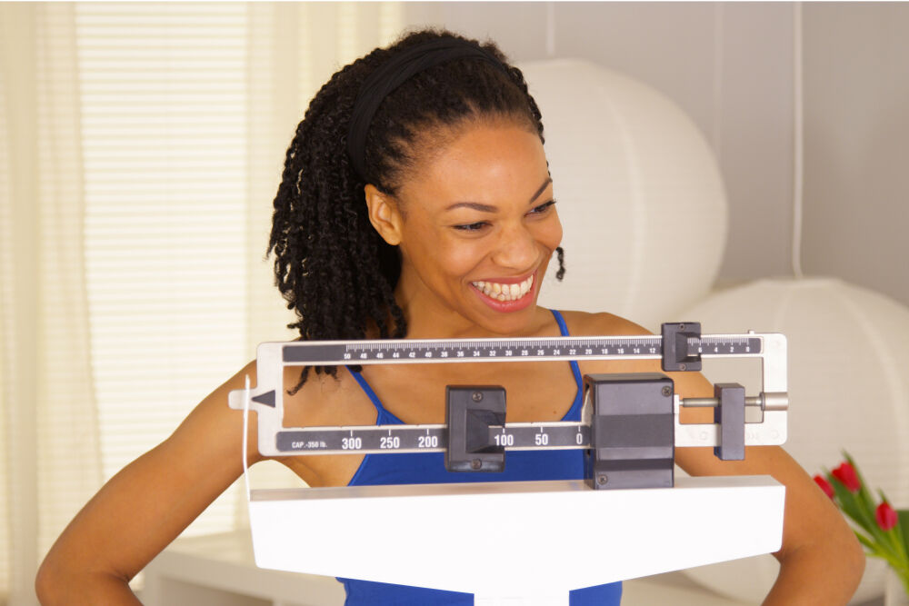 Woman happy with her weight.